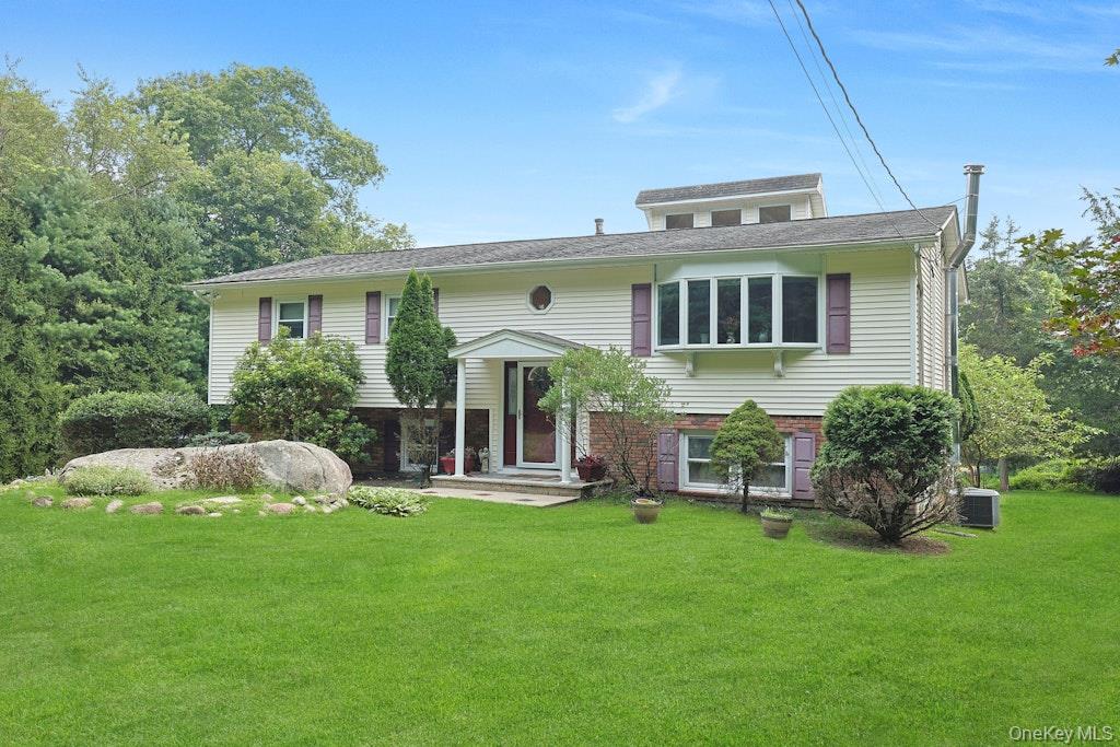 15 Augur Road Airmont, NY 10901 - Photo 1 of 1 Bi-level home featuring a front lawn and brick siding