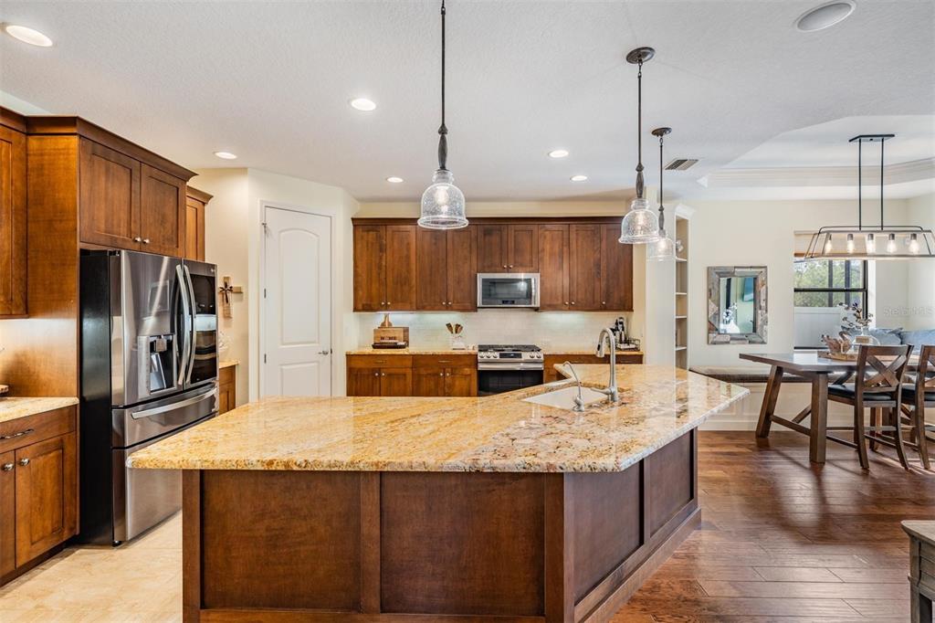 WOW! Rich cabinets, granite counters and more than ample storage