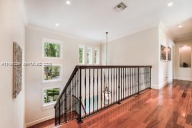 7821 Southwest 54th Court Miami, FL 33143 - Photo 11 of 22 a view of a hallway with wooden floor and stairs