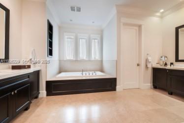 7821 Southwest 54th Court Miami, FL 33143 - Photo 17 of 22 a bathroom with a bathtub sink and mirror