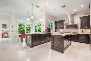 7821 Southwest 54th Court Miami, FL 33143 - Photo 6 of 22 a kitchen with stainless steel appliances granite countertop a stove a sink a oven a dining table and chairs