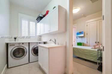 7821 Southwest 54th Court Miami, FL 33143 - Photo 9 of 22 a bedroom with a washing machine and a sink