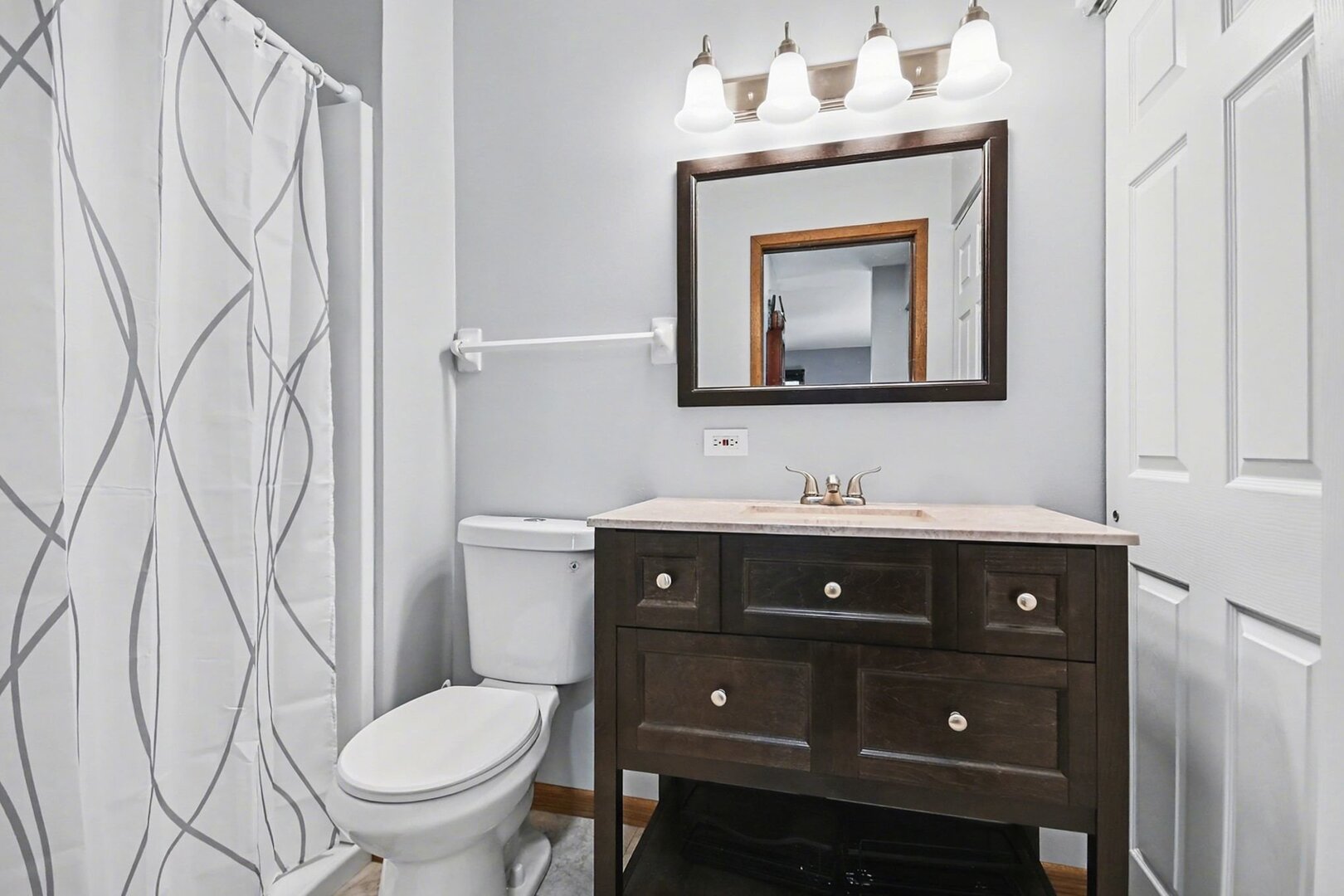 1484 Stonebridge Circle, Unit B6 Wheaton, IL 60189 - Photo 11 of 16 a bathroom with a sink vanity mirror and toilet