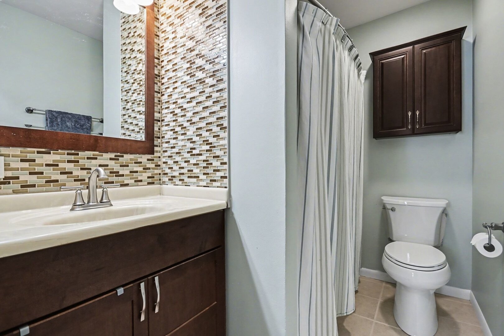 1484 Stonebridge Circle, Unit B6 Wheaton, IL 60189 - Photo 12 of 16 a bathroom with a sink and a mirror