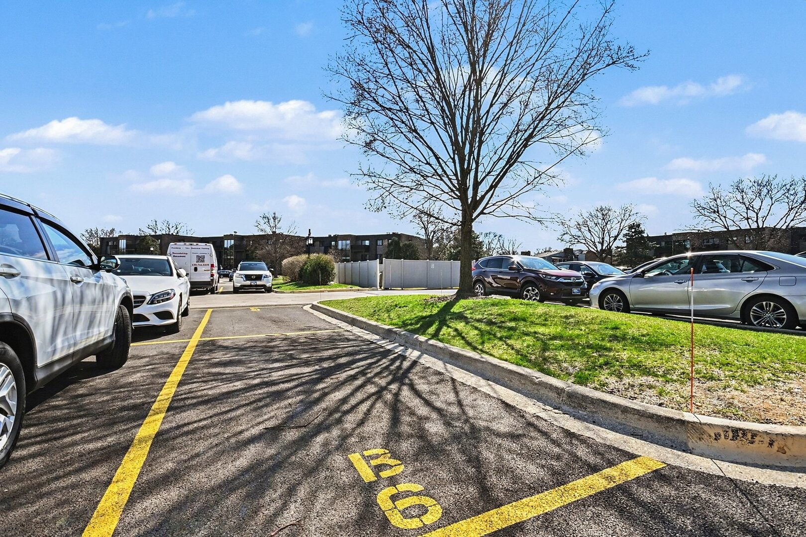 1484 Stonebridge Circle, Unit B6 Wheaton, IL 60189 - Photo 15 of 16 a view of a yard with cars parked