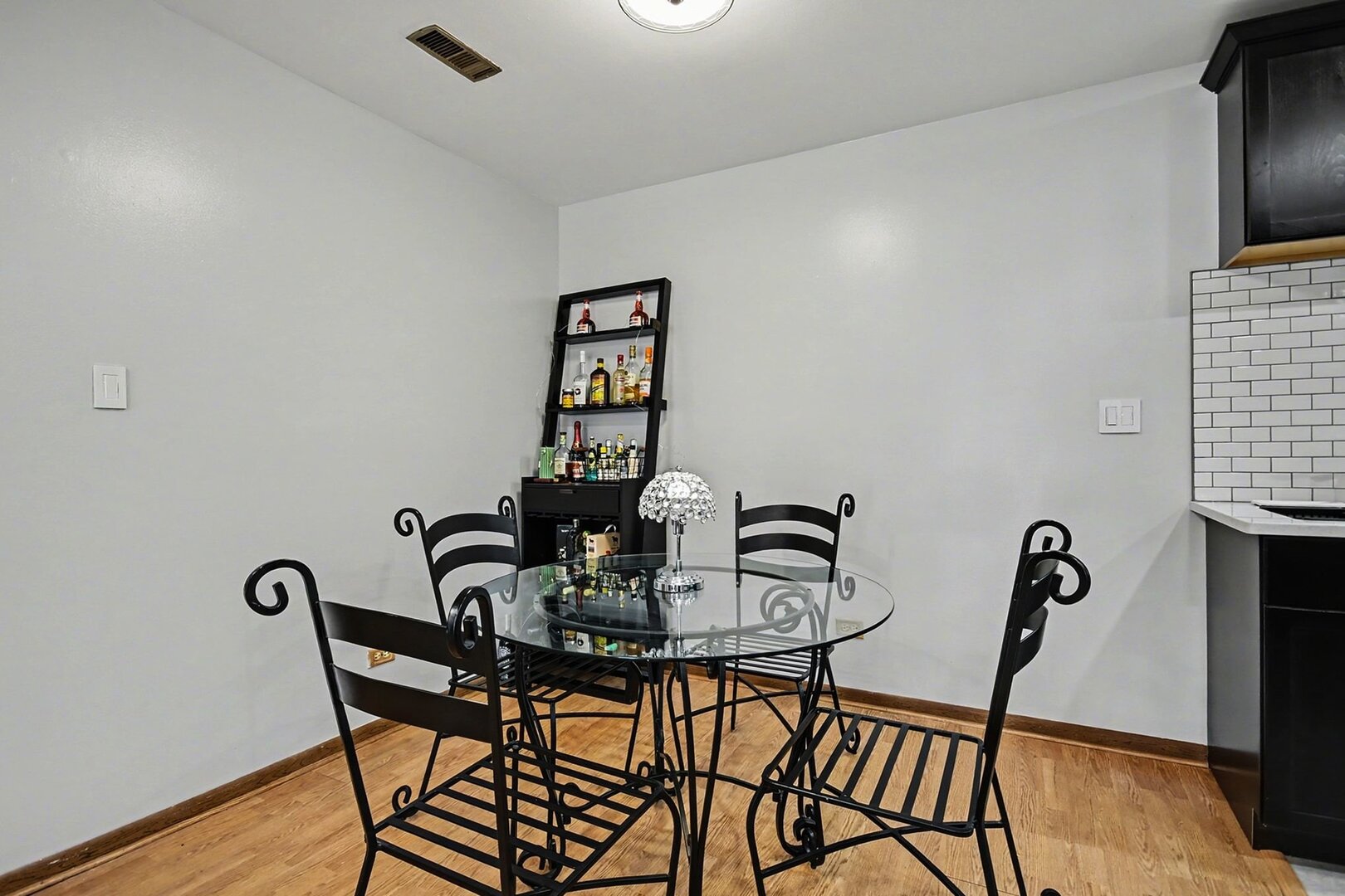 1484 Stonebridge Circle, Unit B6 Wheaton, IL 60189 - Photo 5 of 16 a view of a dining room with furniture and wooden floor
