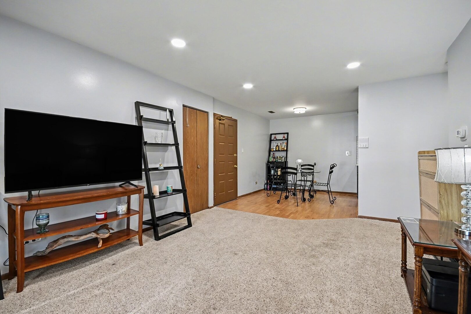 1484 Stonebridge Circle, Unit B6 Wheaton, IL 60189 - Photo 8 of 16 a view of a livingroom with furniture and a flat screen tv