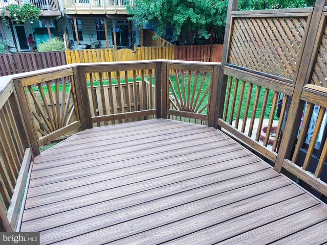 a balcony with view of stairs and the floor