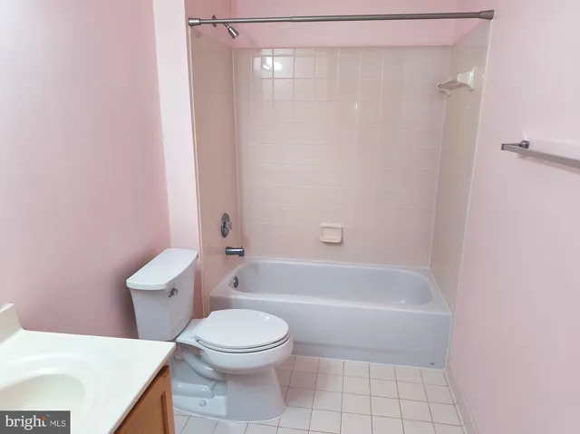 a bathroom with a toilet and a bathtub