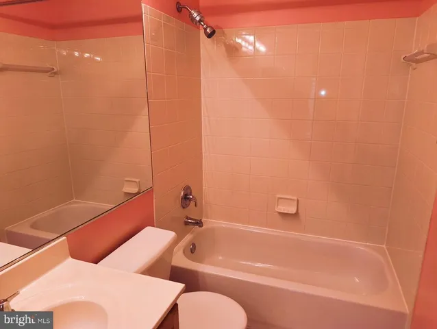 a bathroom with a tub and shower