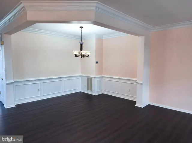 a view of a room with wooden floors and led lights