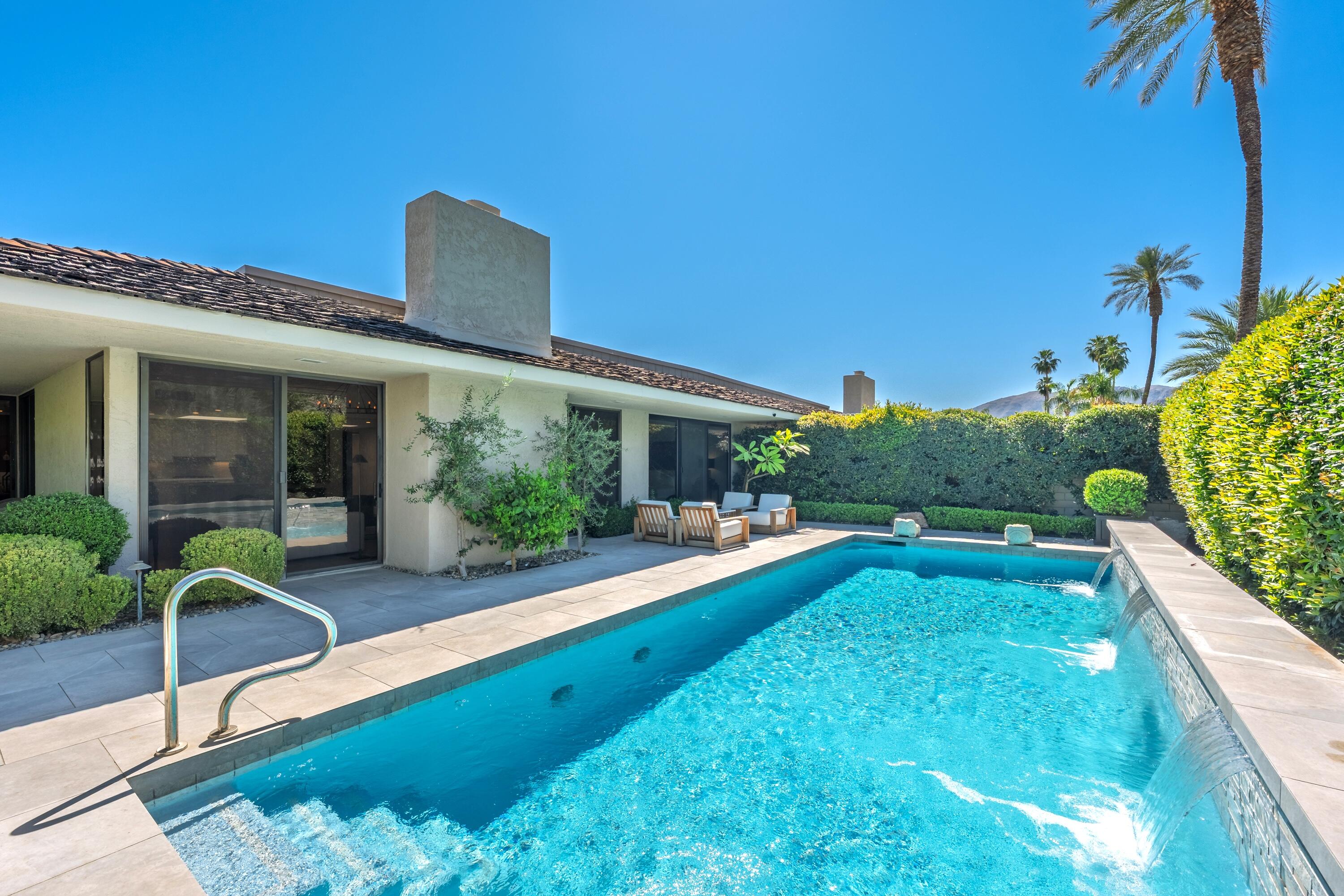 46 Princeton Drive Rancho Mirage, CA 92270 - Photo 16 of 43 a view of a house with swimming pool and porch