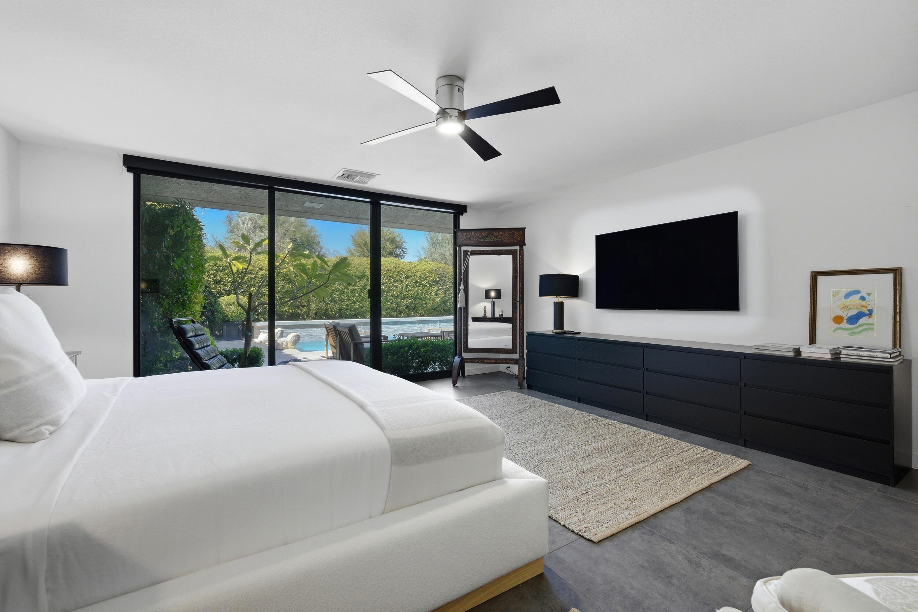 46 Princeton Drive Rancho Mirage, CA 92270 - Photo 34 of 43 a bedroom with a bed window tv and a window