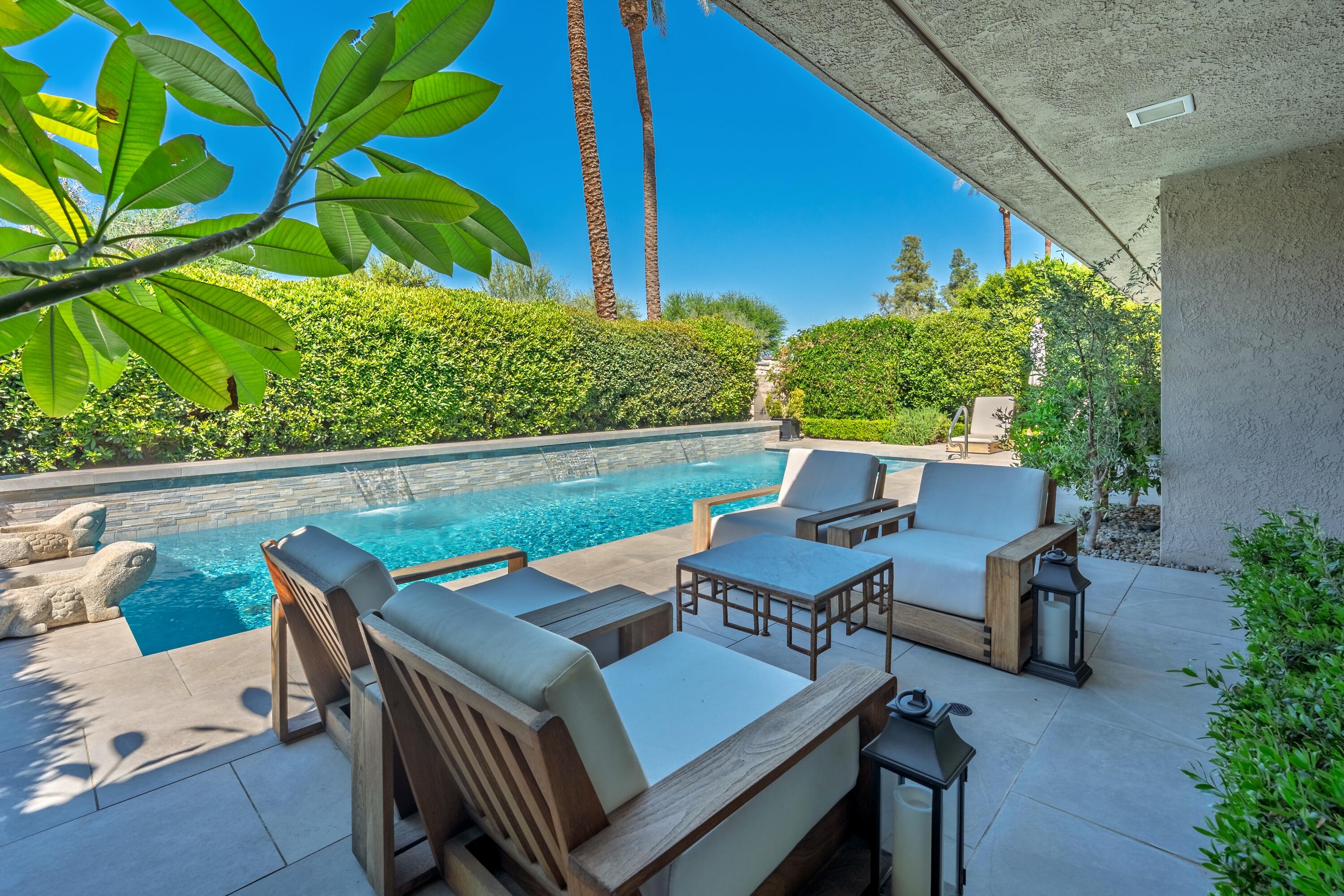 46 Princeton Drive Rancho Mirage, CA 92270 - Photo 9 of 43 a view of a patio with table and chairs and potted plants