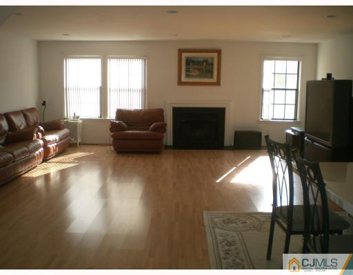 4102 Springbrook Drive Edison, NJ 08820 - Photo 2 of 10 a living room with furniture window and a flat screen tv