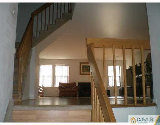4102 Springbrook Drive Edison, NJ 08820 - Photo 6 of 10 a living room with furniture and a fireplace