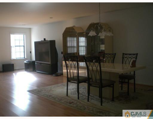 4102 Springbrook Drive Edison, NJ 08820 - Photo 8 of 10 a dining room with furniture and wooden floor