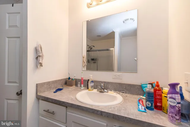 a bathroom with a sink double vanity and a mirror