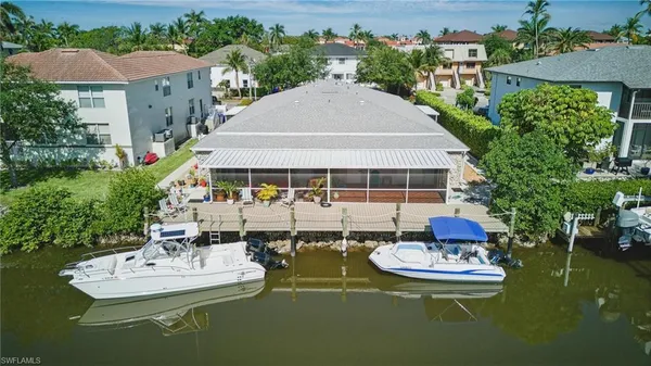 an aerial view of a house with outdoor space