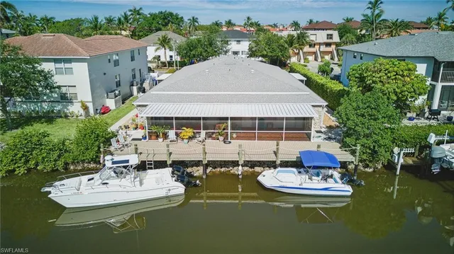 an aerial view of a house with outdoor space