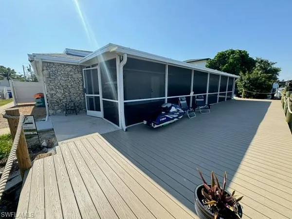 a view of outdoor space with wooden floor and seating