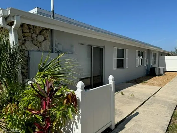 a flower plants in front of a house