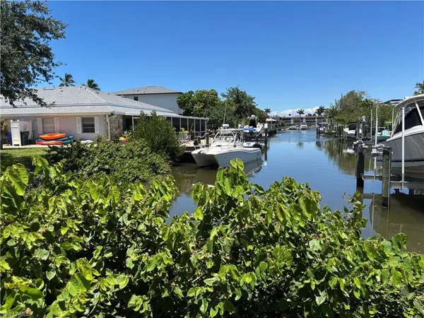 a aerial view of a house with swimming pool garden and patio