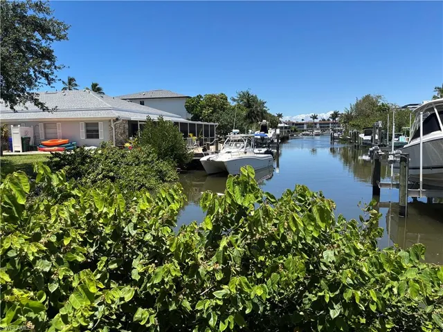 a aerial view of a house with swimming pool garden and patio