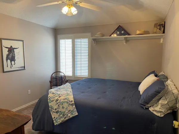 a room with window and a chandelier