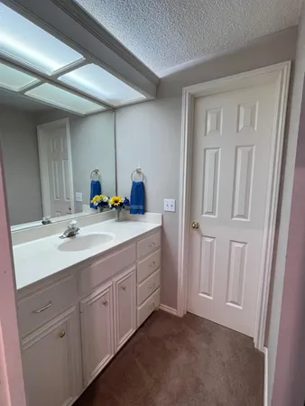 a bathroom with 2 sink tub and a mirror