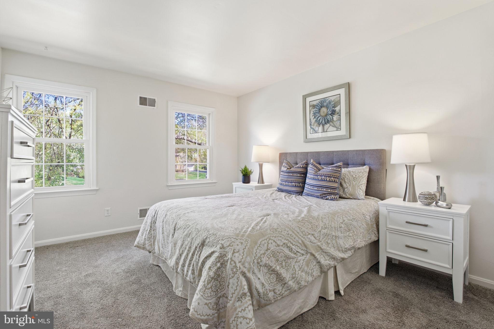 15101 Redgate Drive Silver Spring, MD 20905 - Photo 28 of 39 a bedroom with a bed and a window