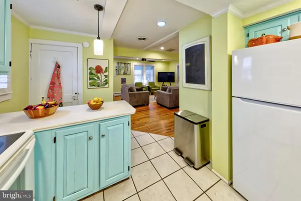 a kitchen with a sink and refrigerator
