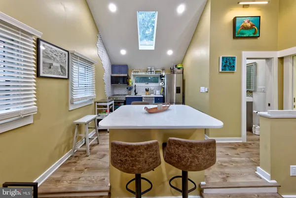 a dining room with furniture and window