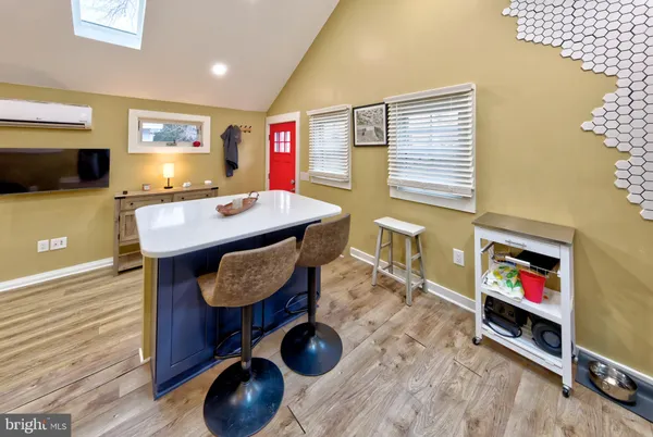 a room with furniture and a flat screen tv