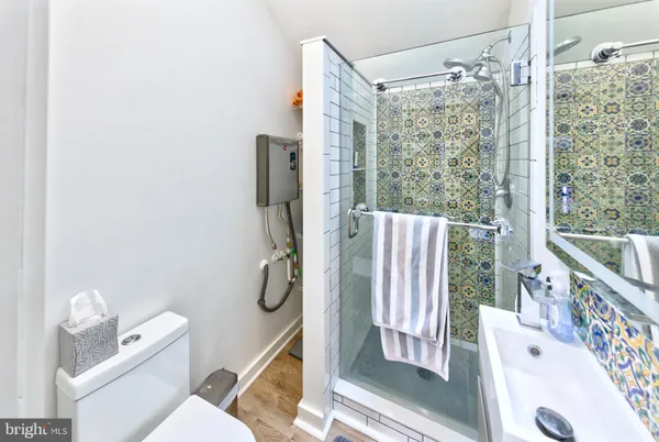 a bathroom with a shower curtain and a sink
