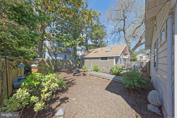 a view of a backyard with sitting area