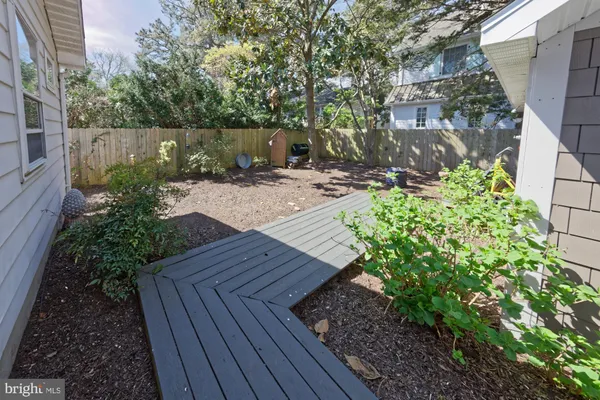 a view of a backyard with sitting area