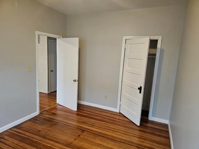a view of entryway with wooden floor