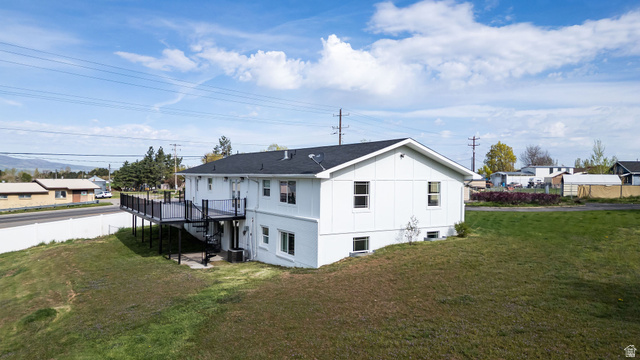 4155 Johnson Road Nibley, UT 84321 - Photo 57 of 71 Rear view of property with a deck, a yard, board and batten siding, and a residential view