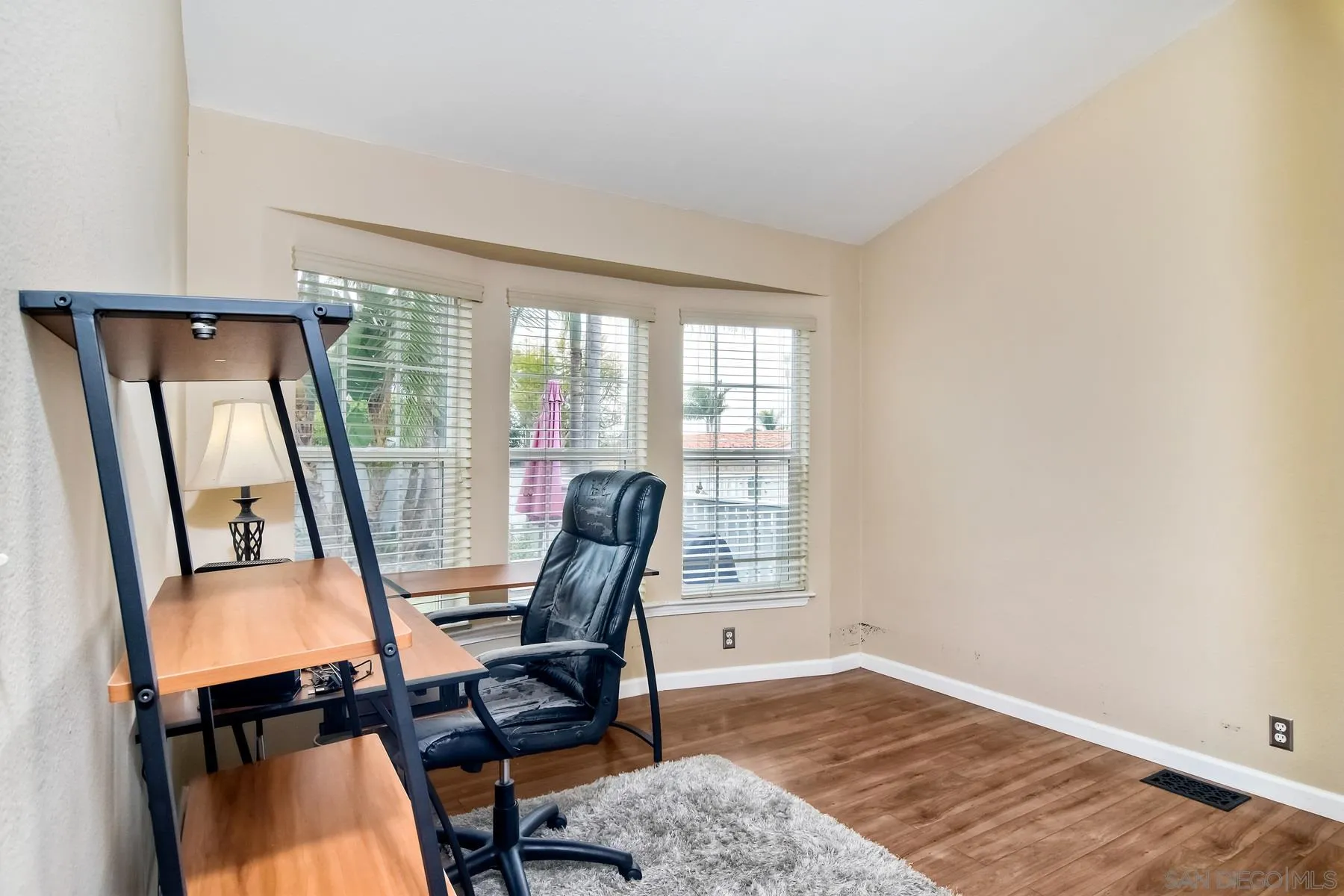 1245 Windsor Road Encinitas, CA 92007 - Photo 15 of 25 a view of a workspace with furniture and a window