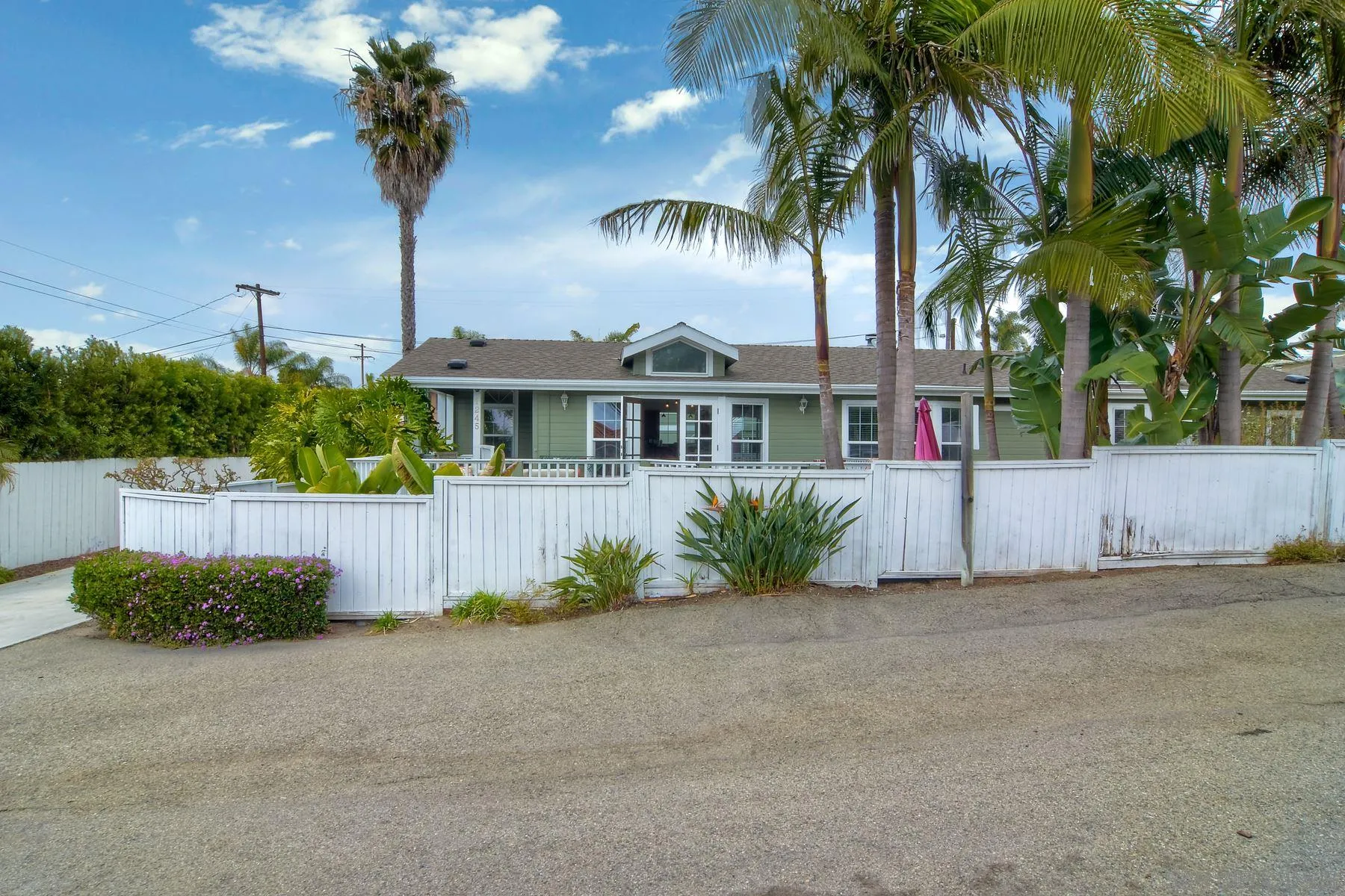 1245 Windsor Road Encinitas, CA 92007 - Photo 2 of 25 a front view of a house with a garden