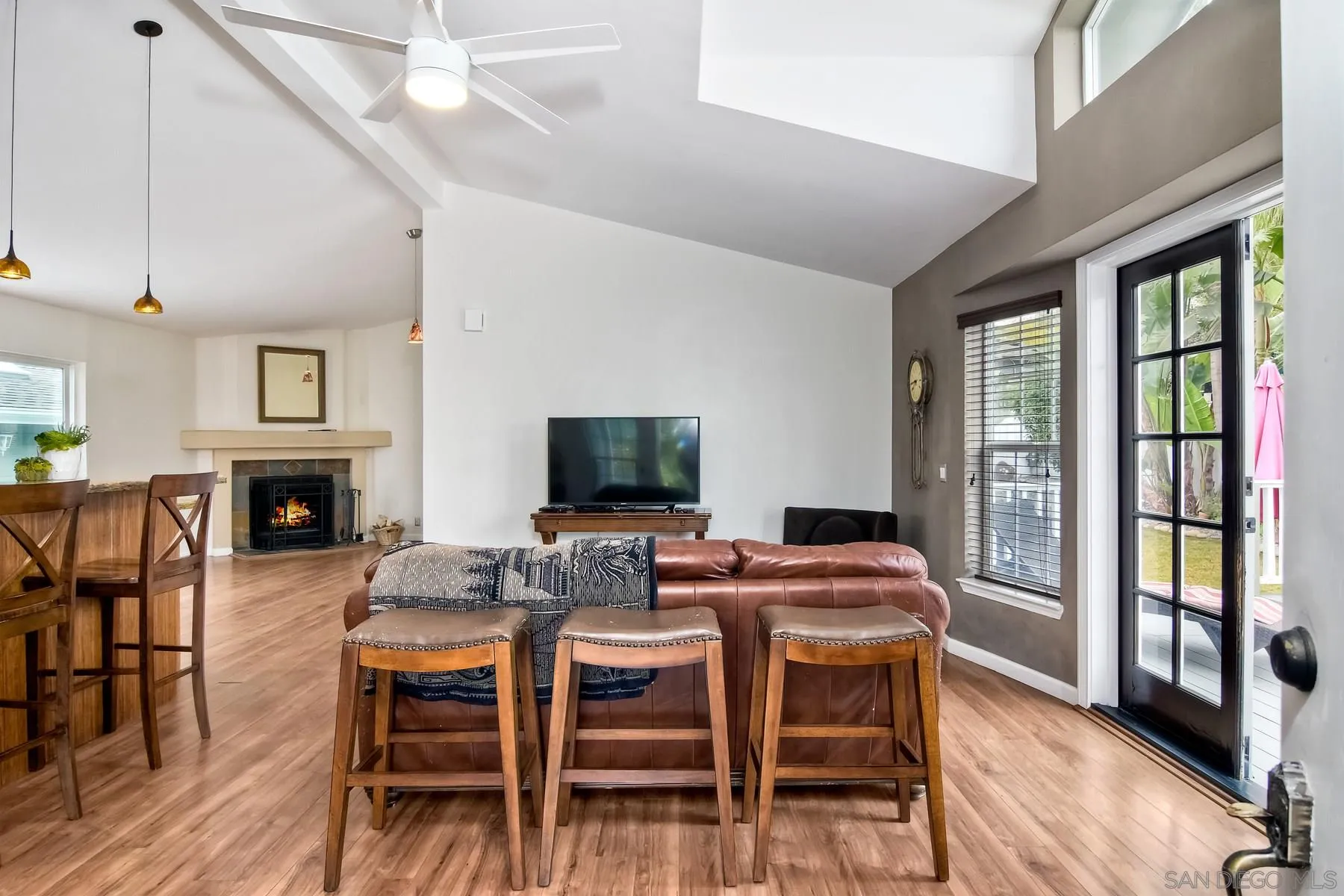 1245 Windsor Road Encinitas, CA 92007 - Photo 4 of 25 a dining room with furniture a window and wooden floor