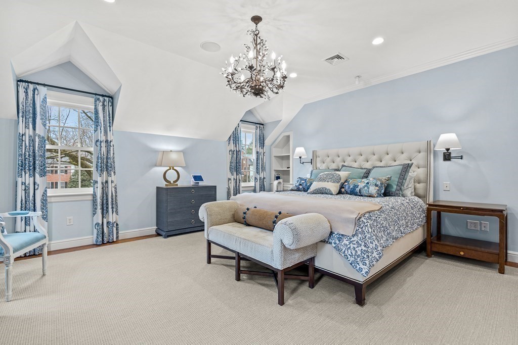15 Woodcliff Road Wellesley, MA 02481 - Photo 16 of 31 a bedroom with a bed and a chandelier