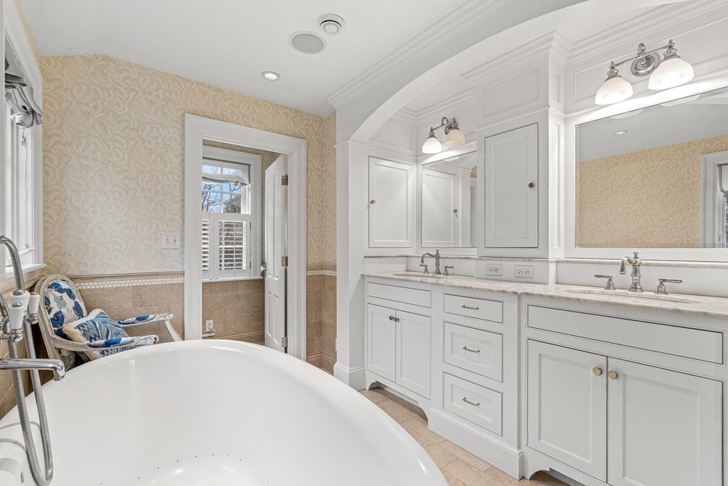 15 Woodcliff Road Wellesley, MA 02481 - Photo 18 of 31 a bathroom with a sink a vanity and a mirror