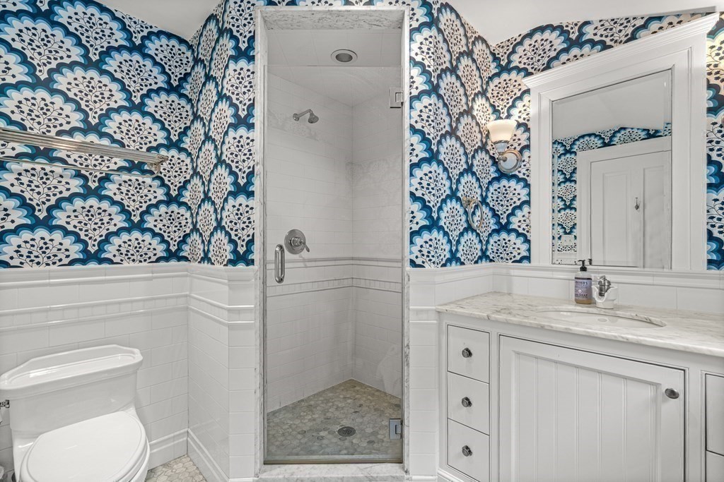 15 Woodcliff Road Wellesley, MA 02481 - Photo 23 of 31 a bathroom with a granite countertop sink and a mirror