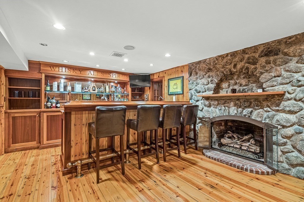 15 Woodcliff Road Wellesley, MA 02481 - Photo 26 of 31 a living room with furniture and a fireplace