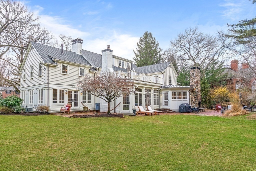 15 Woodcliff Road Wellesley, MA 02481 - Photo 31 of 31 a front view of a building with garden and trees