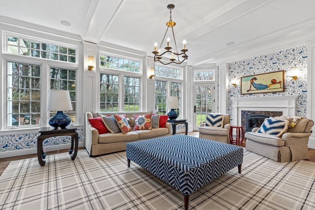 15 Woodcliff Road Wellesley, MA 02481 - Photo 8 of 31 a living room with furniture a fireplace and a chandelier