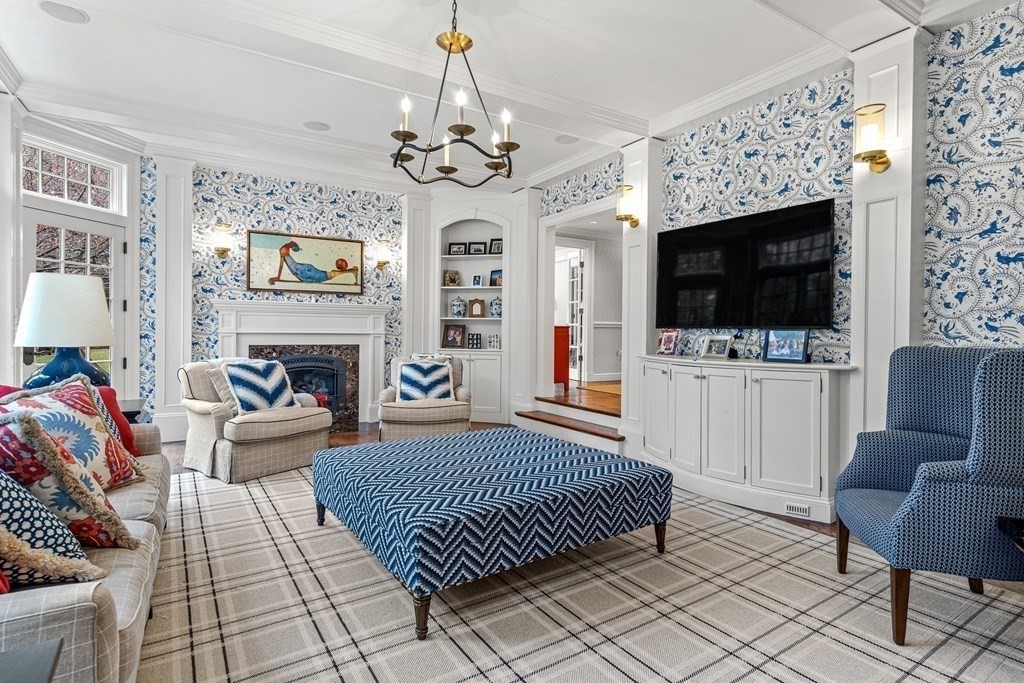 15 Woodcliff Road Wellesley, MA 02481 - Photo 9 of 31 a living room with furniture a flat screen tv and a fireplace
