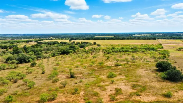 a view of a lake with houses in the back